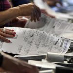Arizona officials ‘deeply concerned’ by armed ‘vigilantes’ at ballot drop box